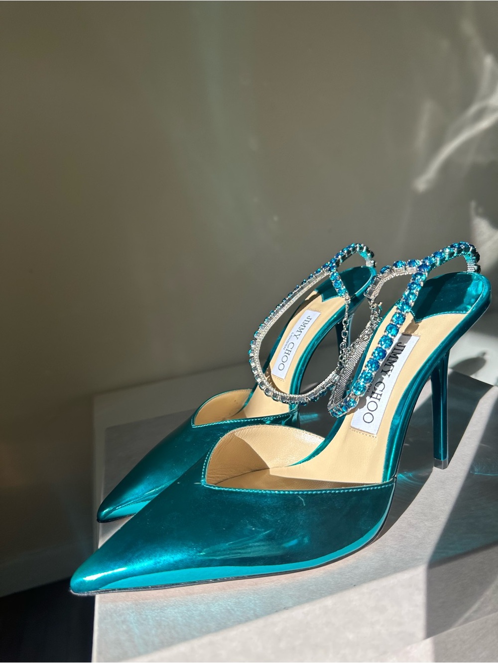 Jimmy Choo Saeda 100
Turquoise Pumps with Crystal Embellishment